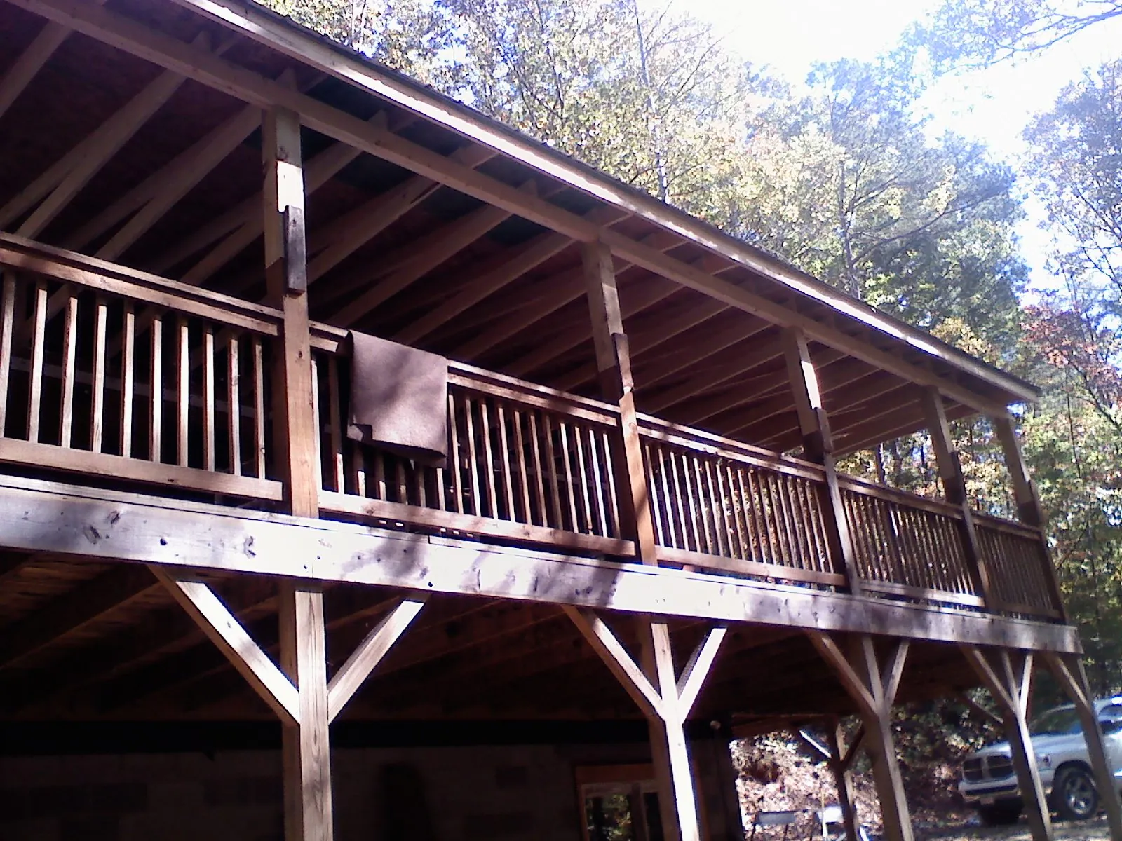 Timber framing under a new elevated porch and deck — Roof Leak Repair in Lingle by Roofing Brothers